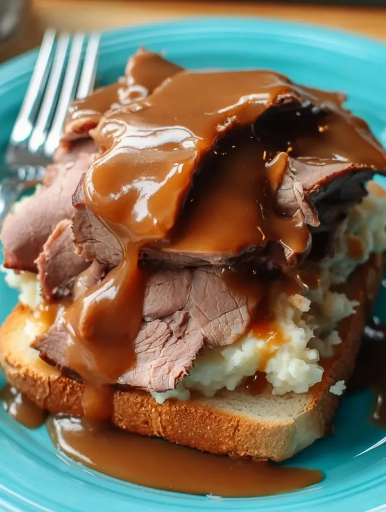 A plate of meat and potatoes.