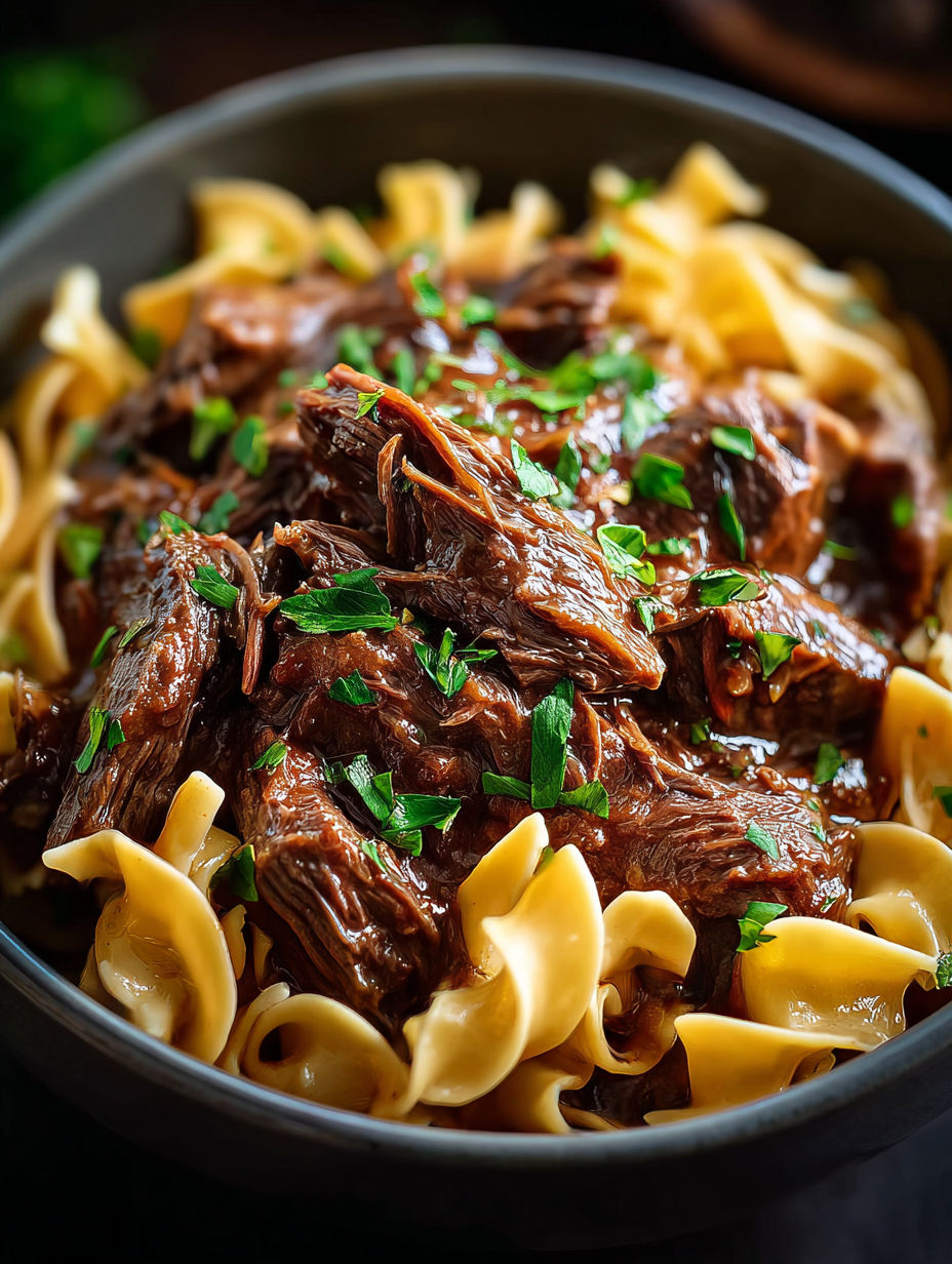 A bowl of beef and noodles.