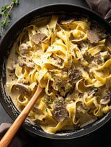 Pasta with mushrooms and truffle oil in a bowl
