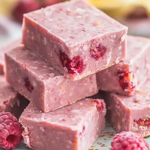 A stack of raspberry coconut delight.
