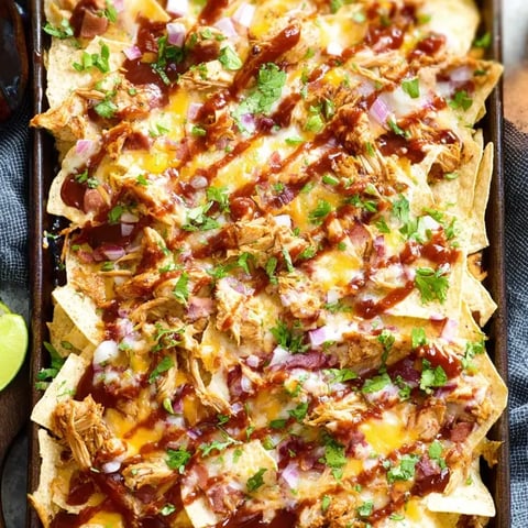 A pan with BBQ chicken nachos piled high.
