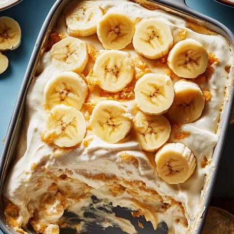 Zoomed in: banana pudding lasagna with crunchy toppings and creamy layers.