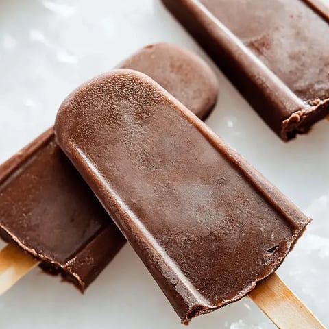 Chocolate ice cream bars on a table.