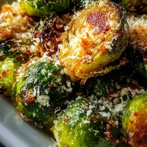Zoomed in on a plate showing green veggies up close.
